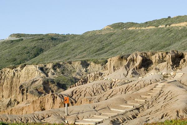 cliffside rocks at cabrillo national monument, san diego california, sculpted by run off water erosion