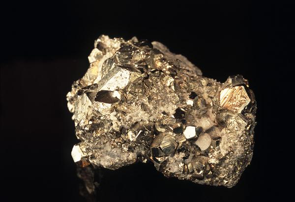 Specimen of crystals of fools gold or iron pyrites on matrix with its characteristic metallic gold appearance