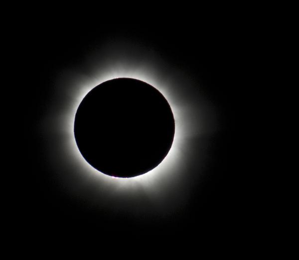 total solar eclipse An eclipse in totality, prominences can be seen as can the light reflection from the suns corona