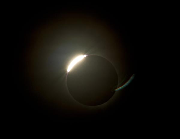 diamond ring The sun emerging from behind the moon during a total solar eclipse with a ring of illumnated corona still visible