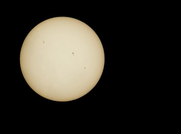 sun spots an image of the suns surface showing sunspots, these dark areas of the surface are caused by intense eletromagnetic activity
