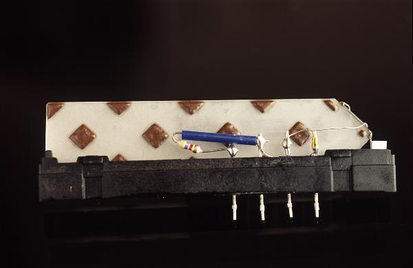 Analogue delay line Analogue delay line designed to introduce a calculated delay into the transmission of a signal using a think wafer of glass and a surface skin effect