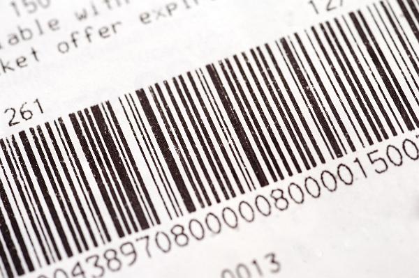 Barcode on a stock item Barcode on a stock item or inventory identifying the description and price by means of bars representing numbers that can be read by a laser scanner
