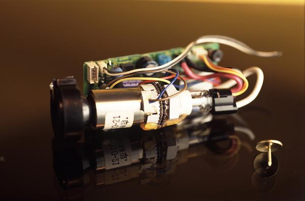 crt view finder before the advent of flat solid state displays, miniature cathode ray tube displays were used as view finders in consumer electronics, this tiny black and white display tube is show alongside a thumbtack for scale
