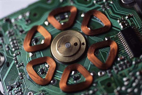 stepper motor a circle of electromagnetic coils forms the motive force for a disk drive stepper motor by inducing currents in the brass rotor in the centre.