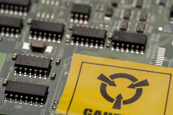 Electrostatic sensitive components Circuit board with caution warning up close, components sensitive to electrostatic fields and ESD