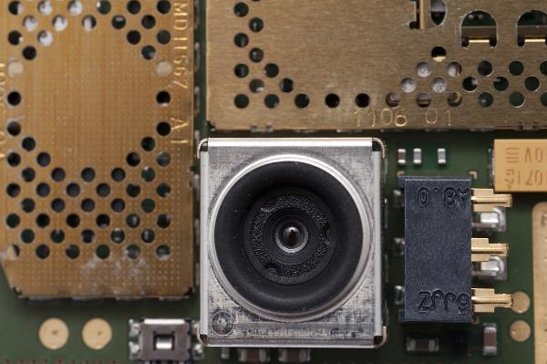 miniature camera a tiny camera from inside a mobile phone, these cameras use piezo materials to focus their lenses or are fixed focus