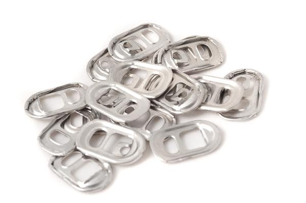 Small pile of opening ring pull Small pile of opening ring pulls from beverage cans manuractured from titanium, viewed in close-up and isolated on white background