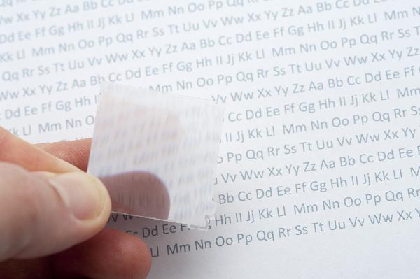 fresnel lens think plastic sheet with tiny fresnel lens elements bends and magnifies light passing through it