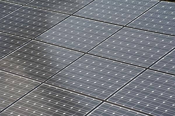 Array of solar panels Array of solar panels or photovoltaic cells converting the solar energy of the sun to electricity in a concept of renewable power and energy